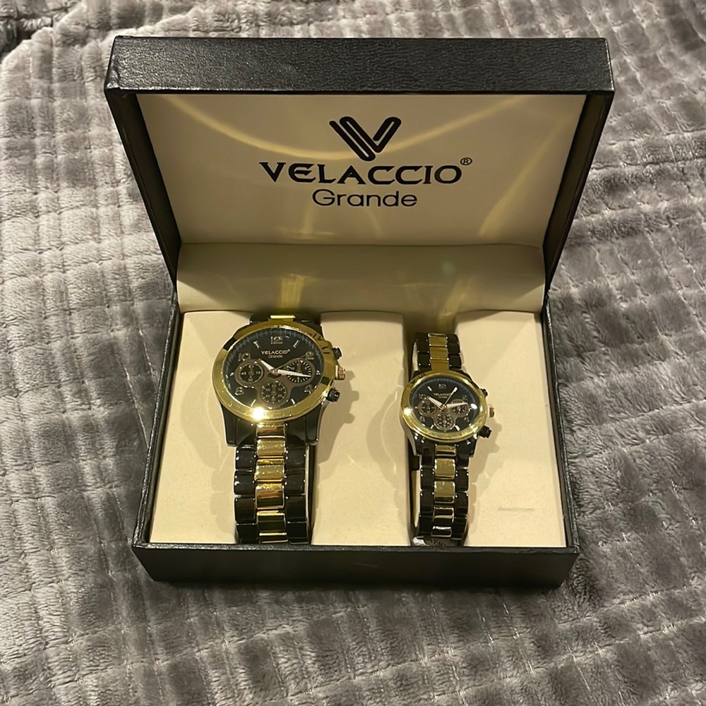 Pair of Men’s and women’s matching watches.  Never worn. Dark gray and gold